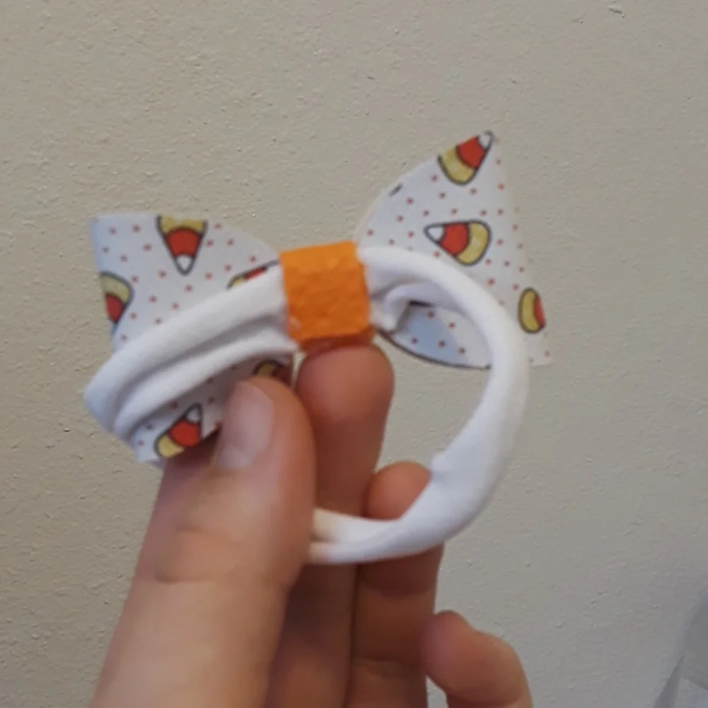 Small candy corn faux leather bow